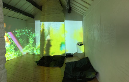 Gallery with images projected onto the walls